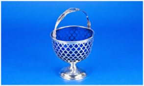 A Silver Sugar Basket on a Pedestal Foot with attractively pierced bowl & blue liner below a swing