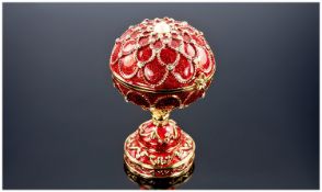 Small Enamelled Faberge-Style Egg Casket, the top opening to reveal lined pouch interior, the out