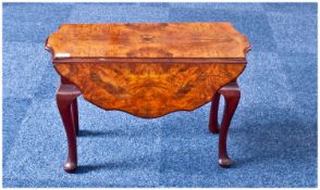 Small Walnut Veneered Coffee Table, of drop leaf form, the top with walnut quarter veneering,