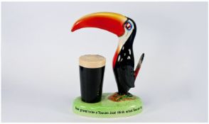 Carlton Ware Guinness Toucan Lamp Base, showing a stylised toucan, standing on a small mound of