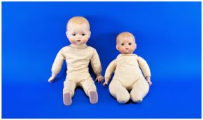Two Various Armand Marseille `Dream Baby` Doll Reproductions, both with fixed blue eyes and painted