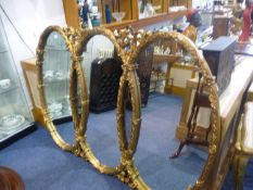 Large Three Sectioned Gilt Mirror, in the form of three intertwined ovals, measuring 43 inches high