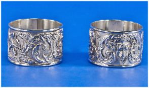 A Pair of Heavy Quality Silver Napkin Rings. Decorated In Bold Relief with Deities Amongst Floral