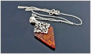 Silver Mounted Amber Pendant, On A Silver Chain.