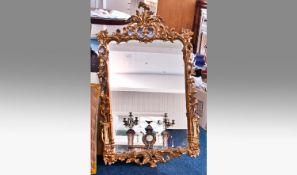 Modern Rococo Style Gilt Framed Mirror, with acanthus finial to top, measuring 43 inches high, 25
