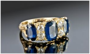 18ct Gold Sapphire And Diamond Ring, Set With Three Oval Sapphires Between Four Old Cut Diamonds In