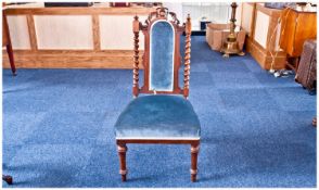 Mid Victorian Walnut Nursing Chair, carved crest rail, turned uprights with finials, upholstered