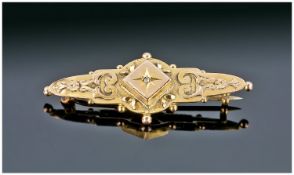 A 9ct Gold Bar Brooch. c.1900. Marked 9 carat and maker S. Bros.