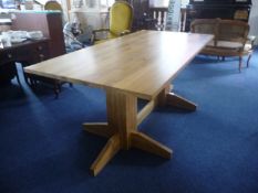 Contemporary Solid Oak Dining Table, the top of solid oak, raised on a double pedestal oak base,