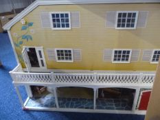 Large Dolls House, in the form of an American house, complete with furniture and fittings, 22½