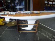 Large Wooden Pond Yacht with alloy masts on stand. Metal Lead weight on the keel. 48`` in length.