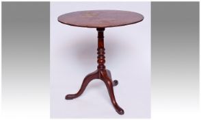 19th Century Mahogany Tripod Table, the oval top with cross-banding to edge, raised on a turned