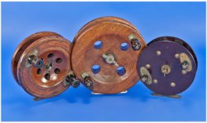 3 Fishing Reels, a Bakelite model with brass fitments and two wooden sea reels.