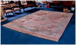 Large Chinese Room Sized Woolen Rug, decorated with a floral pattern on a pink ground.