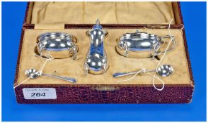 A Boxed Silver Three Piece Cruet Set of mixed hallmarks comprising pepper pot, mustard pot and
