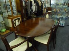 Contemporary Mahogany Dining Table and Six Chairs, table raised on stand with two splayed legs to