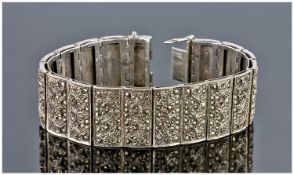 Broad Silver Bracelet, Each Of The 17 Hinged Links Decorated With Three Raised Leaves And
