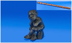 Carved African Seated Figure, with a chiefs carved African walking stick with a carved head and a