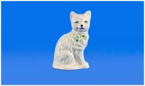 Belleek Quizzical Cat Figure, seated facing right with head turned to the front, white body with 2