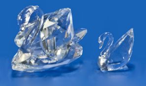 Swarovski Cut Crystal Large And Mini Swan Figures. Designer Max Schreck. Large no. 7633 063 000.