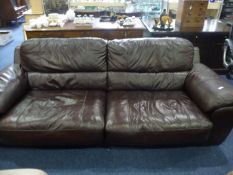 Comtemporary Brown Leather Three Seater Settee, measuring 32 inches high, 91 wide and 38 deep.