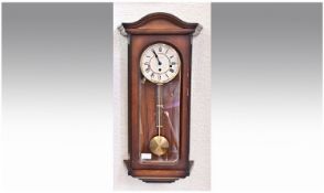 Large Wall Clock in Wooden Case with Westminister Chime. 25 inches high.