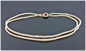 Double Strand Cultured Pearl Necklace, Of Graduating Form With Gold Clasp Set With A Ruby Coloured