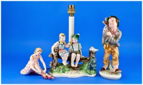 Three Royal Belvedere Pottery Figures, Vienna. Made in Austria. One depicting two children sitting