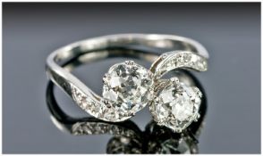 Platinum Diamond Ring, Set With Two Old Round  Brilliant Cut Diamonds, Gallery Mount On A Twist,