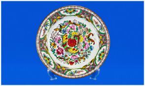Famille Rose Style Cabinet Plate, hand painted over print outlines, the centre decorated with an