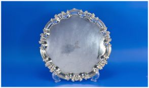 A Victorian Silver Salver of Good Quality with pie crust borders, supported on 3 scroll feet.