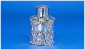 A Victorian Fine Silver Lidded Tea Canister/Caddy of round form. Decorated with stylised floral