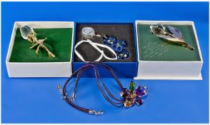 Four Boxed Sets of Swarovski Jewellery, comprising two Crystal Memories, brooch necklace, and