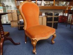 Mid Victorian Walnut Ladies Chair, of balloon back form, with upholstered back and seat, raised on