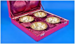 A Fine Silver and Gilt Set of 4 Ornate Bon Bon Dishes. Each 4.25 inches diameter. Stamped silver.