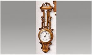Early 20th Century Oak Barometer and Thermometer, carved to sides with scrolls, broken pediment and