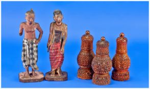 Three Carved Pepperettes, carved from Indian nuts, with 2 carved wood gesso Indian figures. c.1900.