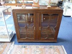 Early 20th Century Oak Side Cabinet, circa 1930, fitted with two doors opening to reveal shelves.