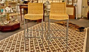Pair of Modern Bar Stools, with wicker seats and backs, each measuring 40 inches high.