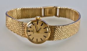 Omega 9 Carat Gold Ladies Manual Wind Wristwatch with 9 carat gold integral bracelet. Fully