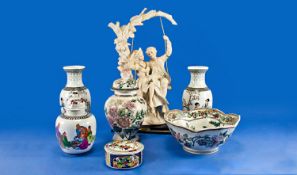 Six Pieces of Oriental Ware, comprising vases and bowls, together with a figure-group of lovers in