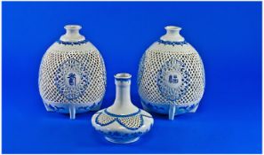 A Pair Of Japanese 20th Century Reticulated Bulbous Shaped Vases of very delicate form. Marks to