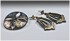 Fine Quality Pressed Tortoiseshell Garniture: comprising a broach in the shape of a Maltese Cross,