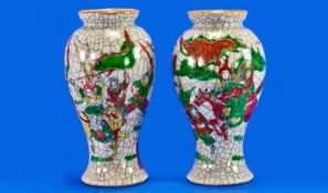 A Pair Of Small Crackle Ware Chinese Vases, decorated with warring figures on a horseback. Circa
