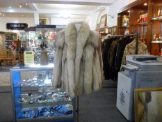 Ocelot and Mid Brown Mink Jacket, the mink collar with revers, slit pockets, half belt to back with