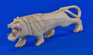 Carved Ivory Lion Figure, 7 inches long.