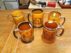 Five Arthur Wood Tankards with scenes depicting `Golfing, Horse and Coaching Scenes`.