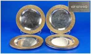 Stuart Devlin, A Set Of Eight Silver And Silver Gilt Side Plates, Circular Form With A Textured