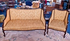 Late Victorian Part Salon Suite, comprising a two seater settee and armchair, the settee with a