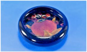Moorcroft Small Inverted Footed Bowl. c.1920`s. ``Pomegranate`` design on blue ground. 4.25 inches